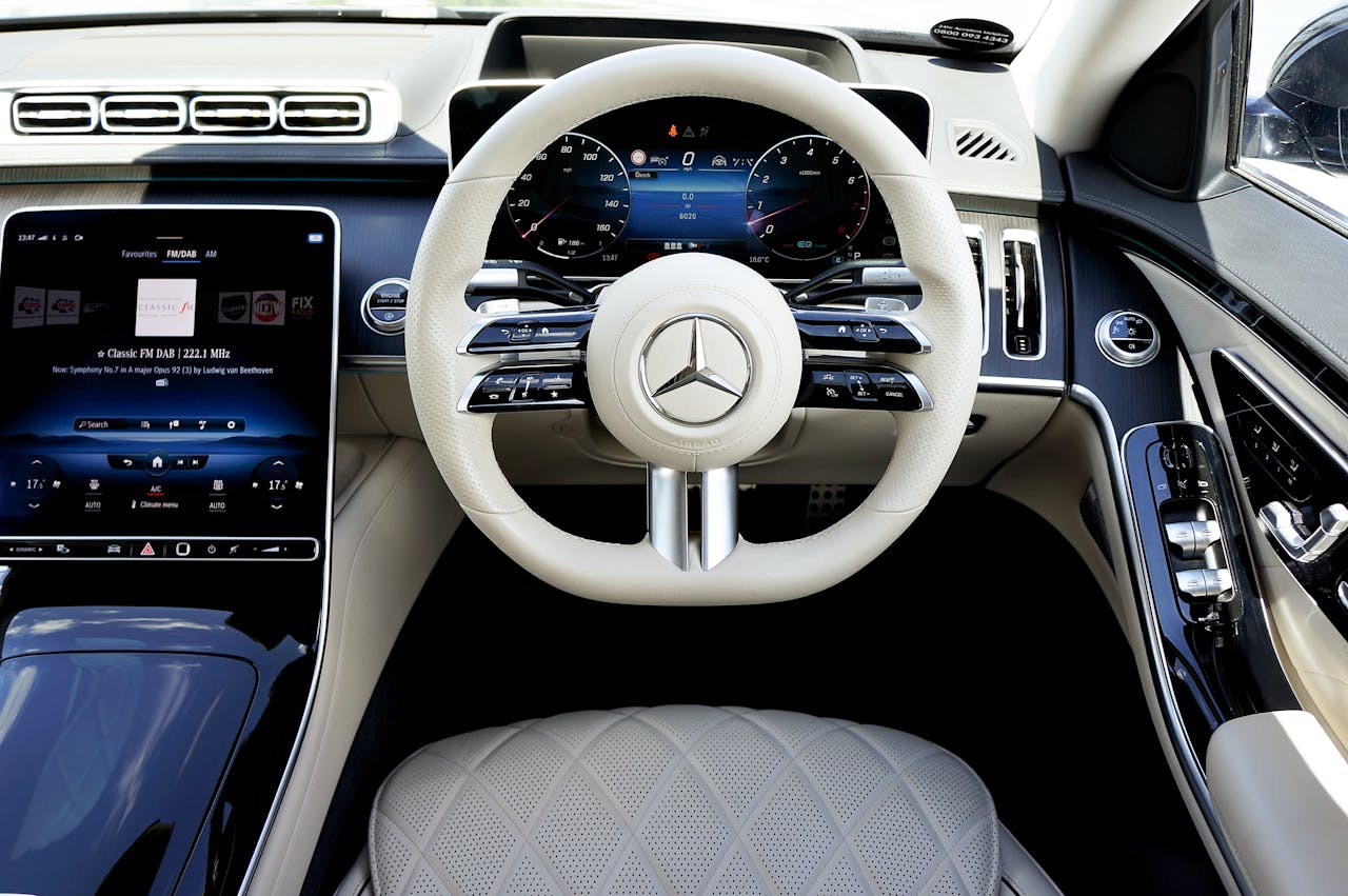 Explore the luxury and modern design of a Mercedes car interior featuring a sleek dashboard and cutting-edge technology.